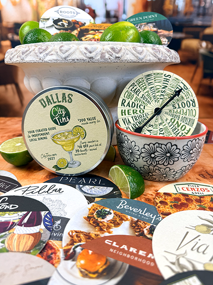 Dallas tin and DinnerSpinner display among coaster gift cards, including Beveryly's, Pillar and Pearl with a stone bowl of limes mimicking the margarita and garnish on tin cover.